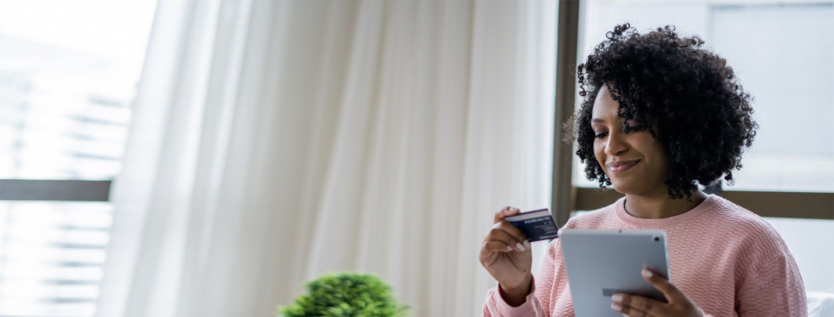 A woman sets up Bill Pay from her tablet.