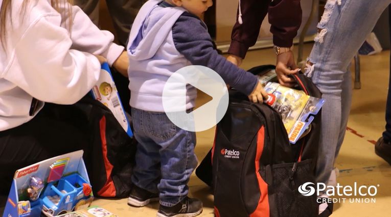 Patelco team members distribute backpacks to families affected by the Camp Fire in Paradise, California.