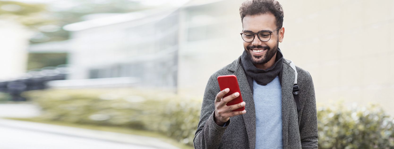 A Millennial reviews his account balance with the Patelco Mobile App.